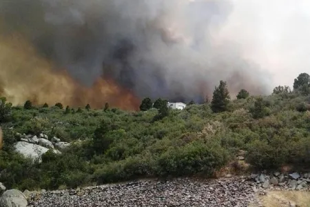 Firefighters stand near the Yarnell Hill Fire in Arizona over the weekend.