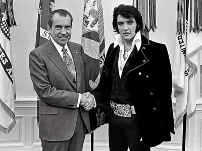 "I'm on your side, " Elvis told Nixon. Then the singer asked if he could have a badge from the Bureau of Narcotics and Dangerous Drugs.