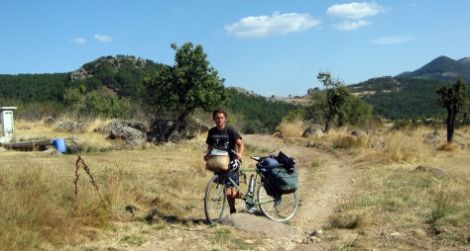 The author runs on empty as he pushes his bike over rough terrain in the Murat Mountains.