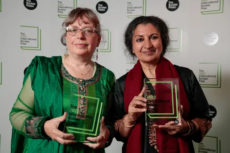 Translator Daisy Rockwell and author Geetanjali Shree hold their International Booker Prize awards.