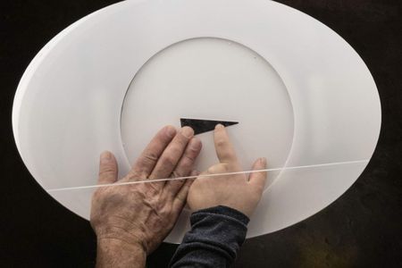 A hand touching the Museum's lunar touchrock. Part of a photo series by Museum photographer Jim Preston.