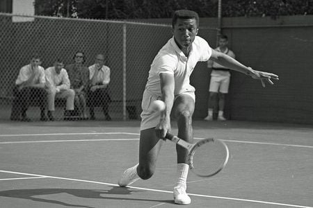 Arthur Ashe&nbsp;playing tennis against Dennis Ralston in 1964