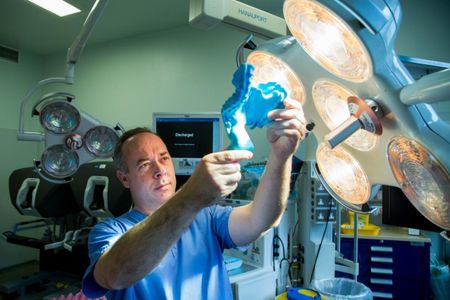 J. Calvin Coffey holds up a model of the mesentery