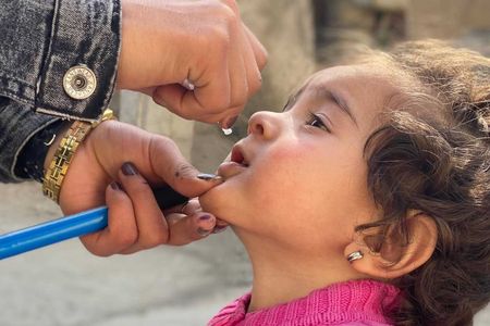 In February, the Covid-19 pandemic halted polio immunization campaigns across Afghanistan and Pakistan, fueling a new resurgence of polio in children. Here, a young girl is given the polio vaccine in the Kabul Province in October after campaigns were resumed.