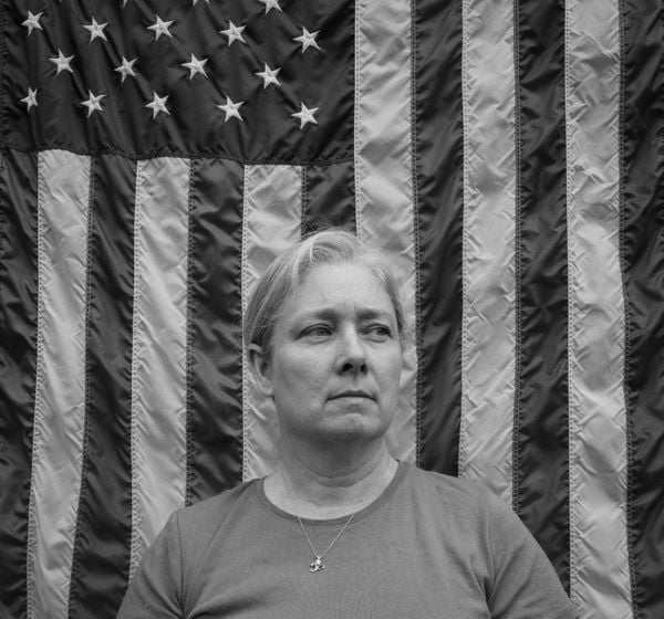 Woman in Front of the American Flag thumbnail