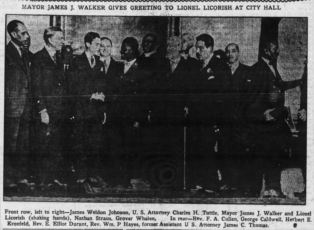 Licorish shakes hands with New York Mayor James J. Walker at City Hall.