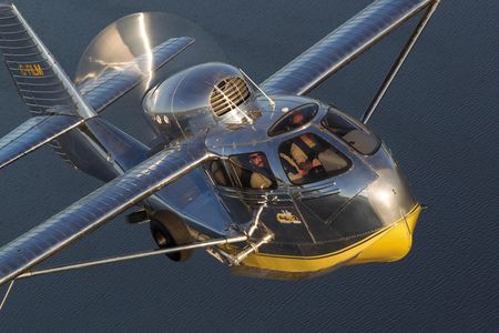 A Republic Seabee, the ideal sportplane, climbs over a Wisconsin lake.