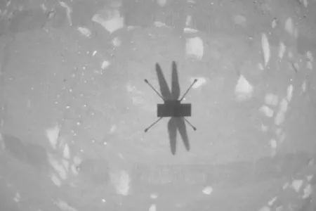 The Ingenuity Mars Helicopter’s shadow seen on the surface of Mars and captured by its own down-facing camera during its second test flight on April 22.
