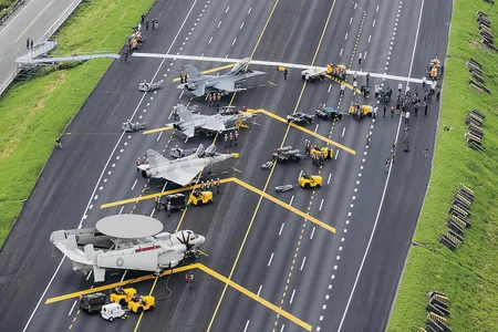 Military aircraft used Taiwan’s main highway as an airstrip during the annual Han Kuang defense exercises. Four sections of the freeway have been designated for emergency use.