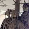 Detailed photo of a bronze sculpture depicting George Washington, Polly Cooper, and Skenandoah from the waist up.