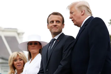 President Donald Trump, French President Emmanuel Macron, first lady Melania Trump, and Brigitte Macron stand during a State Arrival Ceremony on the South Lawn of the White House in Washington, Tuesday, April 24, 2018