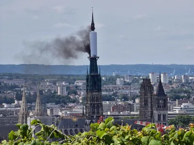 A plastic tarp covering part of the cathedral&#39;s spire caught fire on July 11.