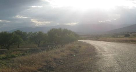 Sunlight bursts through a ceiling of rainclouds above the lonely west shore of Lake Burdur.