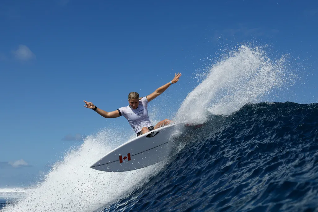 Woman surfing a big wave