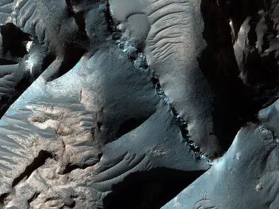 Image of the cliffs at Terra Sabaea on Mars. The description was recently translated into Icelandic and posted to the Beautiful Mars Iceland Tumblr. 