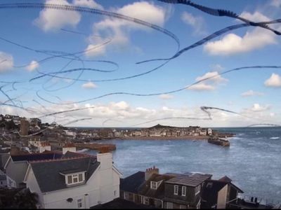 These fragmented black lines are actually seagulls flying