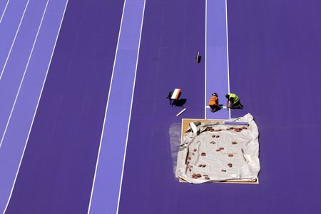 Crews even used purple glue while adhering the vulcanized rubber track to its asphalt base.