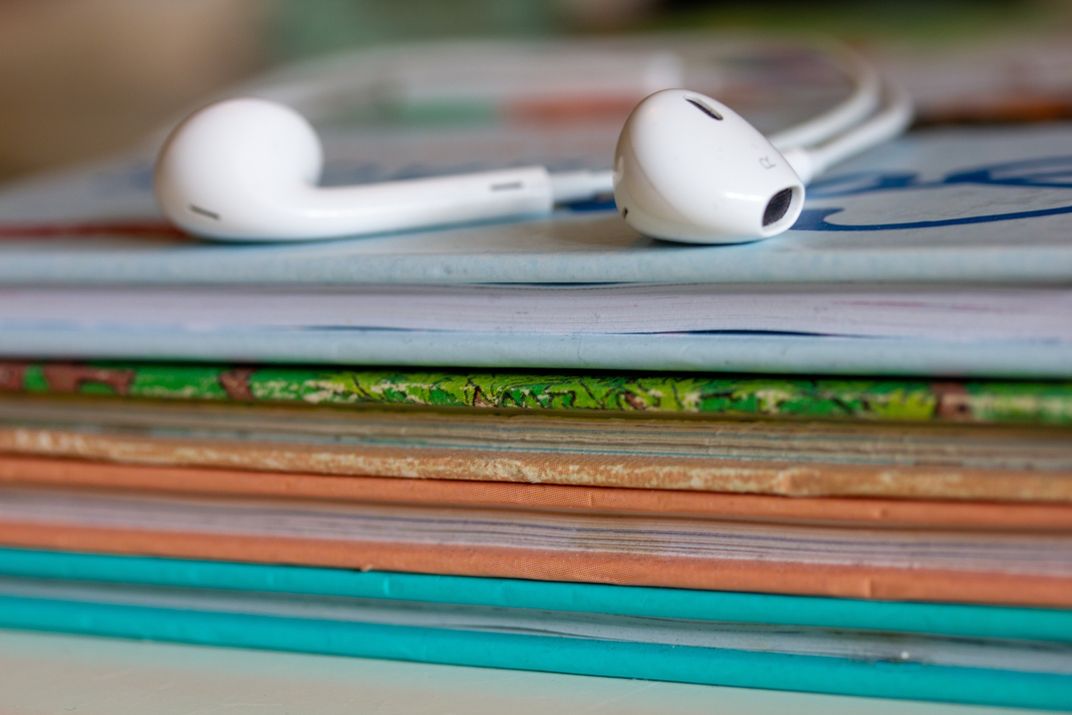 Earbuds on books