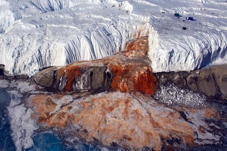 Blood Falls seeps from the end of the Taylor Glacier into Lake Bonney.