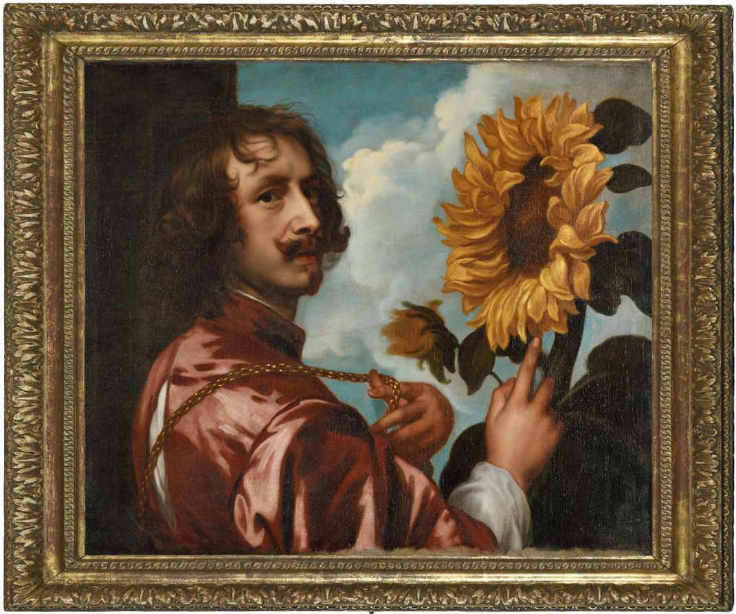 A painting in a gold frame depicting a man with a mustache and curly dark hair, wearing a red silk tunic and gesturing toward a sunflower bloom as big as his head