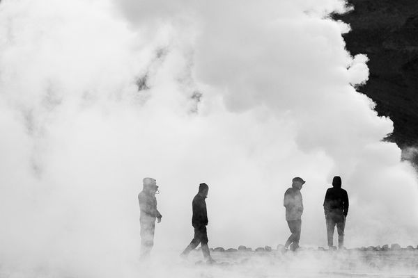 Friends immersed in geyser smoke. thumbnail