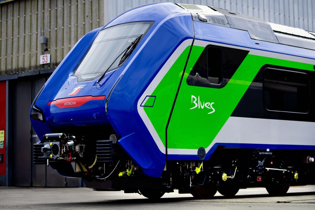 Blue train with green shape and white stripe