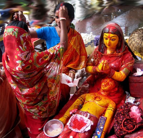 Married women are exchanging holy sindur on the occasion of Janmastami festival. thumbnail