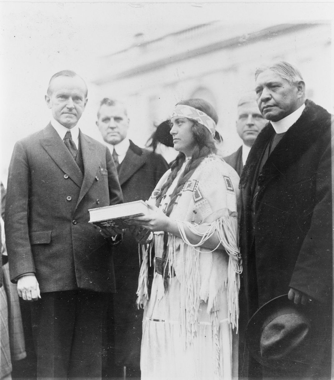 Ruth Muskrat presents a book to Coolidge in December 1923.