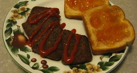 Snowpocalypse scrapple with ketchup, served with a side of toast.