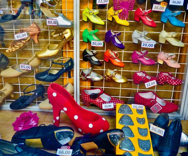 Dazzling, colorful dancing shoes brighten store window display in Madrid, Spain thumbnail