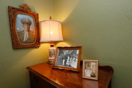 Family photographs decorate the master bedroom in the home of Civil Rights leaders Medgar and Myrlie Evers.