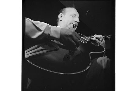 Carl Kress, performer of "Heat Wave" on Volume I, focuses absolutely on his guitar-playing.