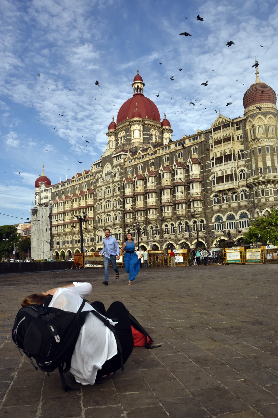 Female wedding photographer shooting a couple with the heritage Taj hotel  at the background | Smithsonian Photo Contest | Smithsonian Magazine