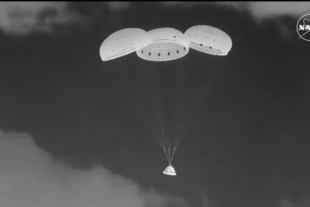 Boeing Starliner&#39;s capsule Calypso deploys parachutes during its descent toward Earth late at night on September 6.