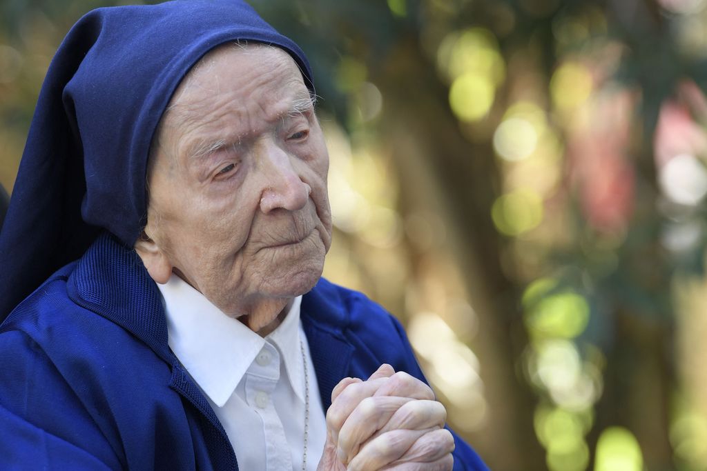 Sister Andre, Lucile Randon in the registry of birth, the eldest French and European citizen, prays in a wheelchair, on the eve of her 117th birthday