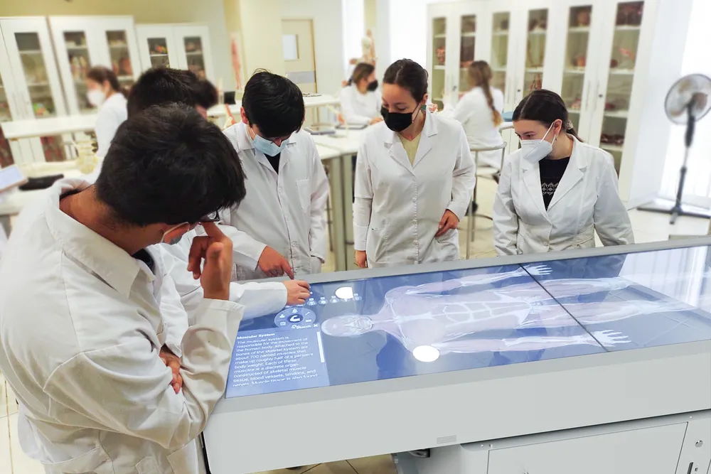students stand around an Asclepius table