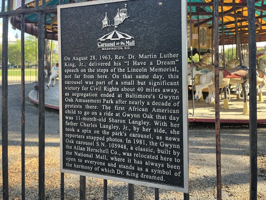 Historical marker detailing the civil rights movement history with the carousel