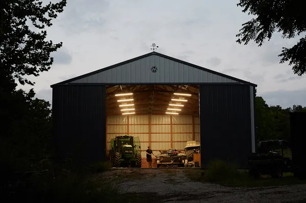 Joe Carr, 32, combines his farming and automotive repair job by repairing the tractors on the family farm. thumbnail