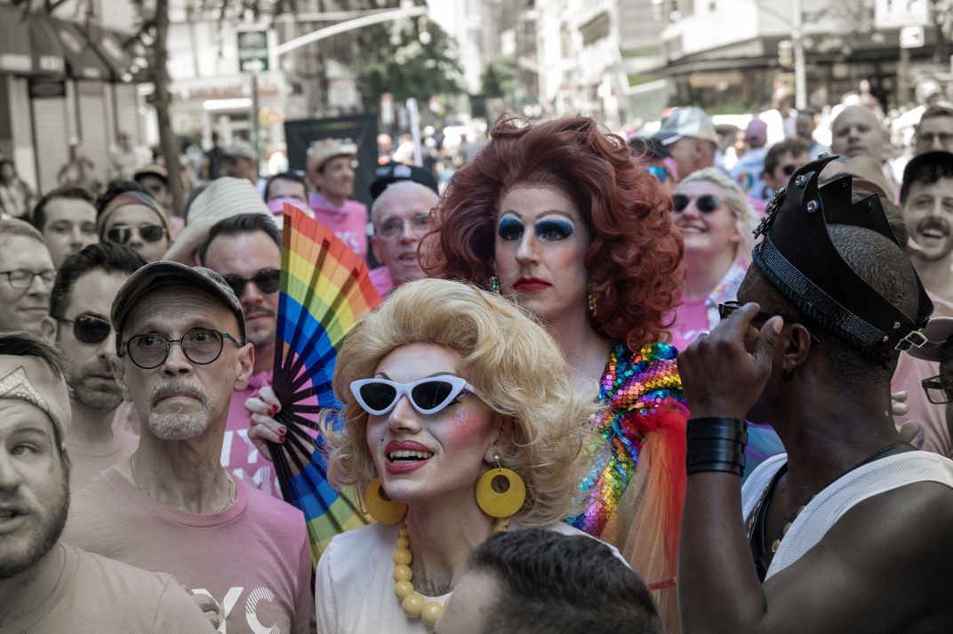 Two wig-wearers add some color to a crowd.