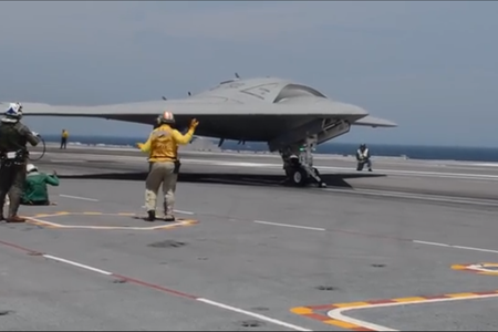 X-47B completes its first unmanned, carrier-based landing.