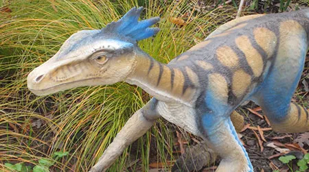 A feathery Troodon on the Museum of Life and Science Dinosaur Trail, in Durham, North Carolina.
