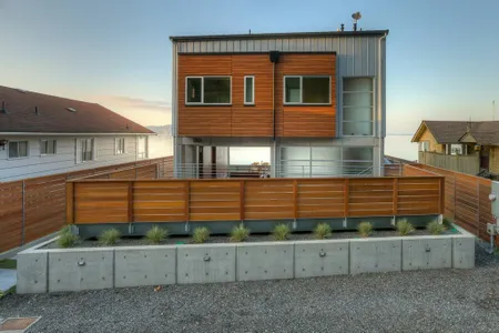 The Tsunami House, on the northern end of Washington's Camano Island, is designed to withstand the impact of high-velocity wave walls with heights of up to eight feet.