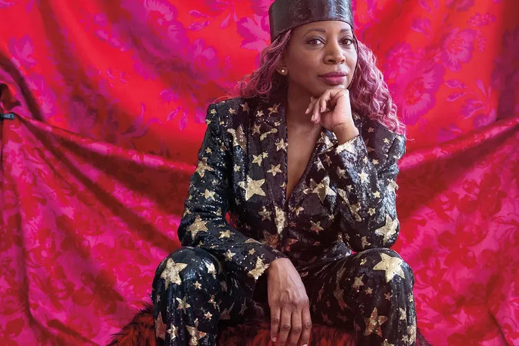 a portrait of a Black woman sitting