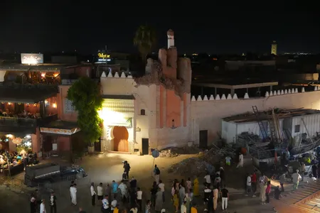 People gather around the damaged Kharbouch Mosque on September 9, 2023 in Marrakesh, Morocco.