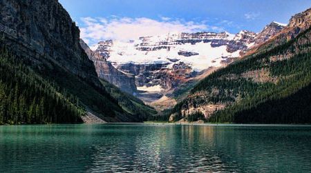 Lake Louise, one of the world’s most beautiful compositions of water, rock and ice, belongs to Canada. The small lake attracts throngs of tourists while serving as a stepping stone to surrounding wilderness areas of the Rocky Mountains.