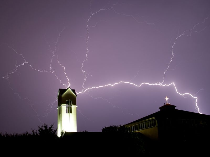 Multiple lightning bolts eminate from St. Michael's church tower. Smithsonian Photo Contest