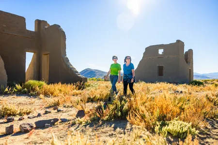 Bright sun shining on the ruins of an abandoned mining town in Nevada's Mojave Desert