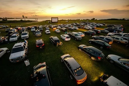 Attendees arrive to watch the movie Grease at a pop-up drive-in theatre at Bucktown Marina Park on May 22, 2020 in Metairie, Louisiana.