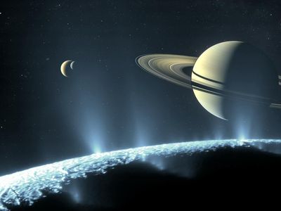 An artistic rendering of Saturn and a few of its many moons