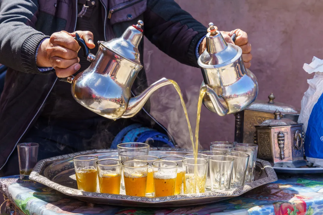 Pouring traditional mint tea